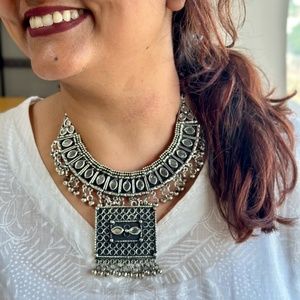 Oxidised silver neckpiece with intricate design